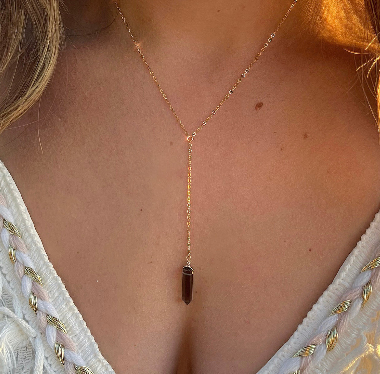 This delicate y necklace features a dainty crystal point in your choice of rose quartz, smoky quartz, amethyst, rainbow fluorite or crystal quartz. A perfect everyday necklace, and also great for layering!