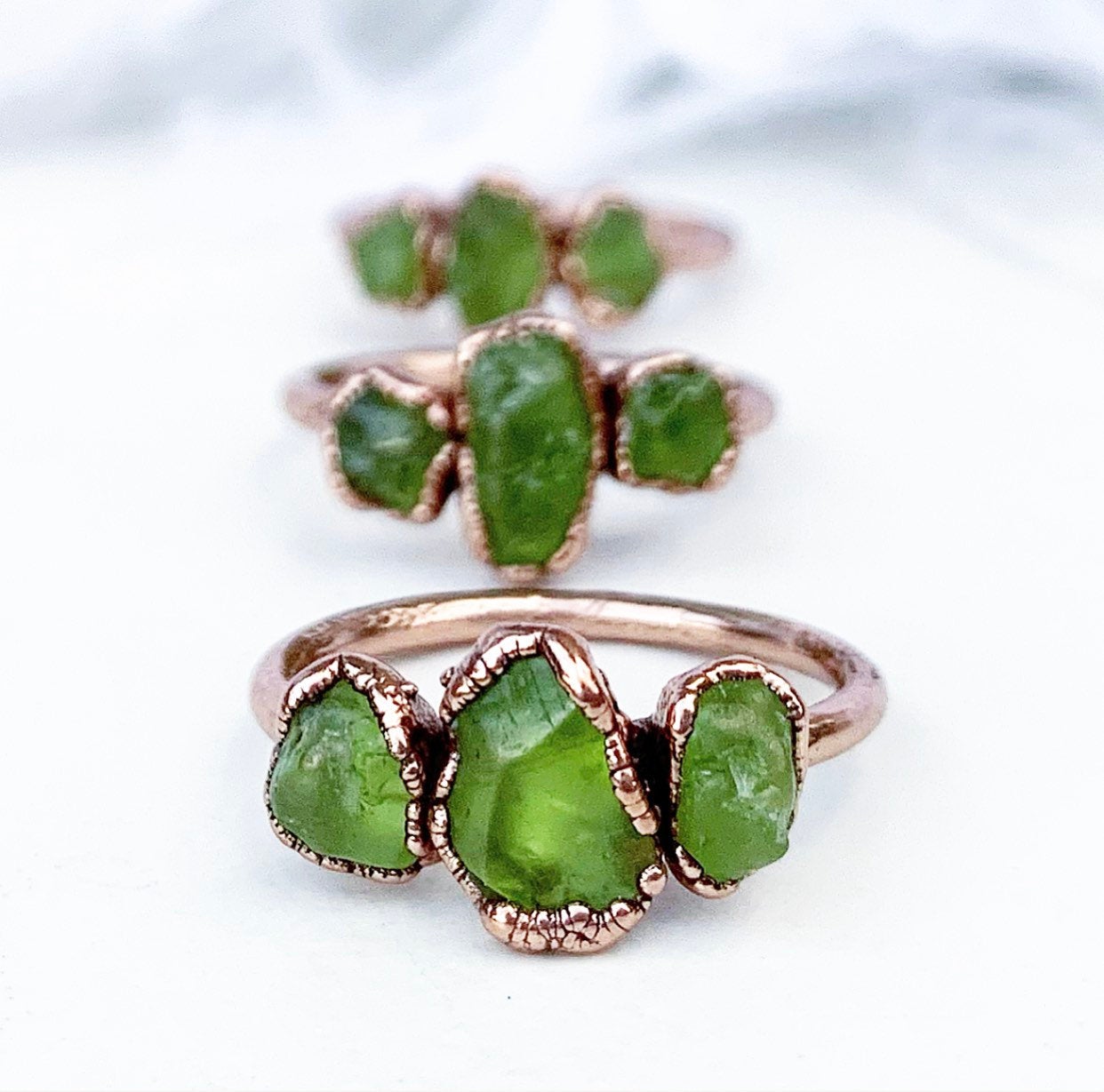 Multiple 3 Stone Peridot Copper Ring
