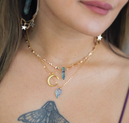 This sweet and dainty angel wing necklace features a carved aquamarine pendant that hangs from delicate, sparkling chain in your choice of 14k gold filled, 14k rose gold filled or sterling silver chain.