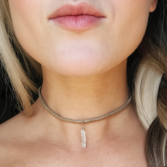 Crystal Choker on Tan Suede, A delicate crystal point in your choice is wrapped with gold or silver wire and sparkles in the center of this tan suede choker.