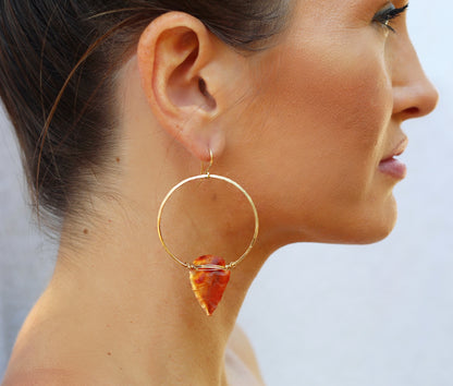 girl wearing carnelian arrowhead hoop earrings